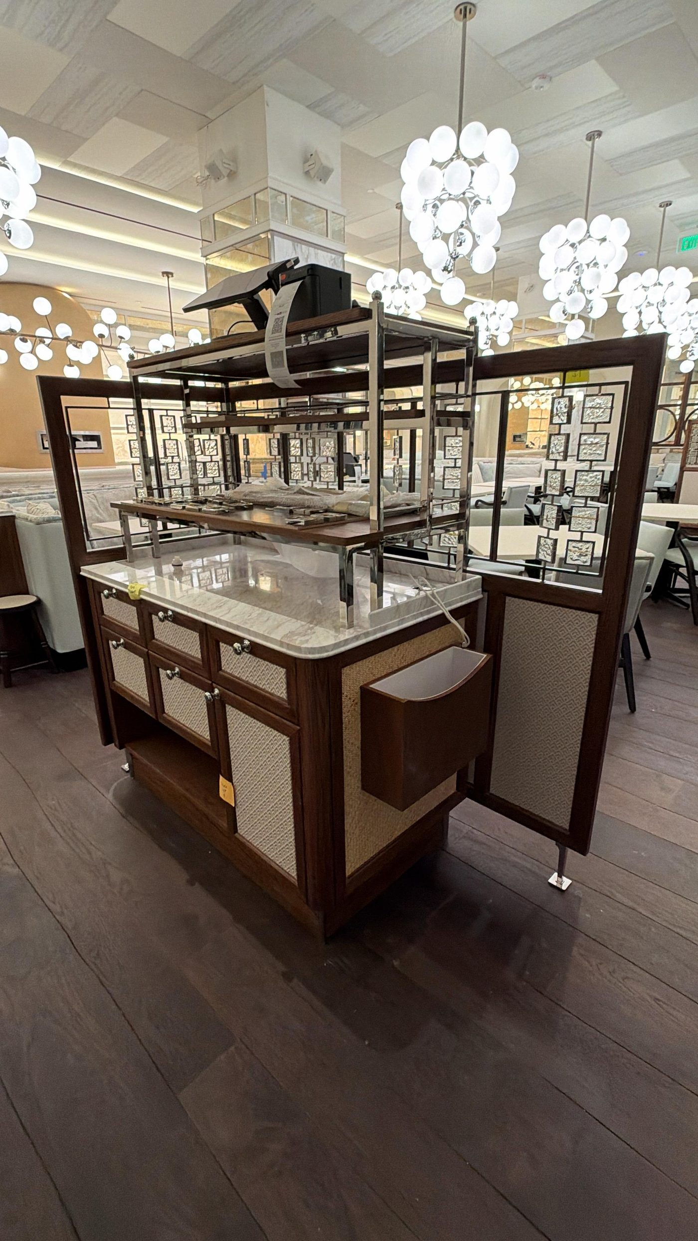 Bespoke hospitality joinery, marble-topped service buffet unit fitted by Aretis Bespoke